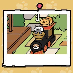 Fred has curled into a "cat loaf" on top of the cardboard train. Marshmallow is still looking out the smokestack, but now has its paws on the outside. Cocoa is looking out of the front of the train where the engine should be.