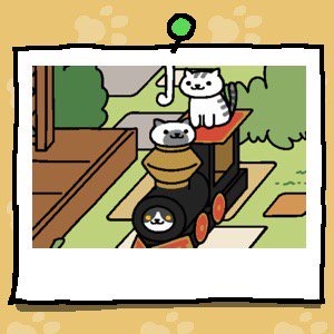 Gabriel is still looking out of the engine part of the cardboard train. Marshmallow is a white cat with a large grey spot around its mouth and grey ears. Marshmallow looks out of the cardboard train's smokestack. Mack is sitting on the top of the train again.