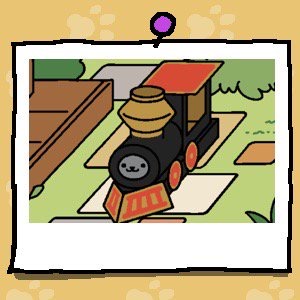 Shadow is a grey cat. The cat is looking out the front of the cardboard train where the engine should be.