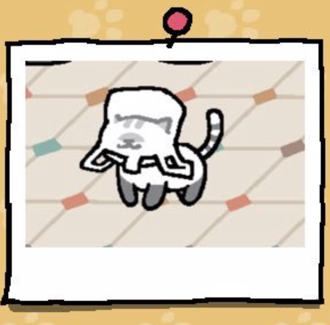 Melange is a white cat with grey paws and a grey spot above their nose. The top of their head has grey stripes, and their tail has white and grey stripes. Melange has stuck their head into a plastic bag.