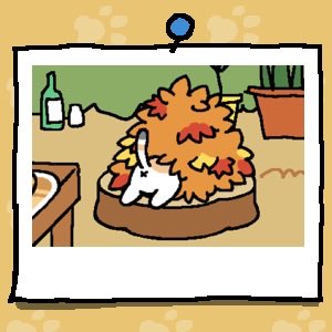 The backside of a white cat with light orange and grey spots sticks out of a pile of leaves.
