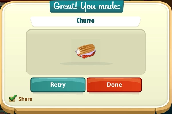 A churro sits in a red paper carton.