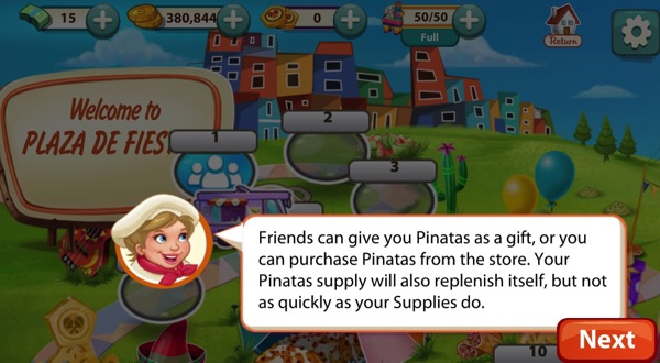 A short blond woman wears a chef hat and a red scarf. She speaks. Behind her is a sign that says Plaza De Fiesta. The Pinatas she mentions are at the top of the screenshot.