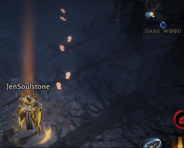 A glowing Crusader, in full armor, carries a shield and a flail. There are glowing footprints behind her. At the top corner, it says "Dark Wood".