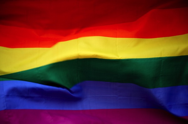 A flag of many colors: Red, orange, yellow, green, blue, and purple. This is the LGBTQ+ flag.
