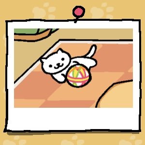 A white cat plays with a fabric ball.