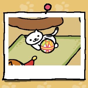 A white cat with small black spots plays with a fabric ball.