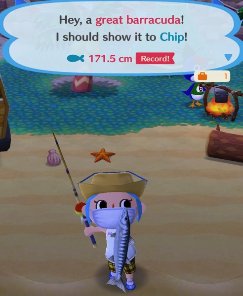 My Pocket Camp character is holding up a great barracuda.
