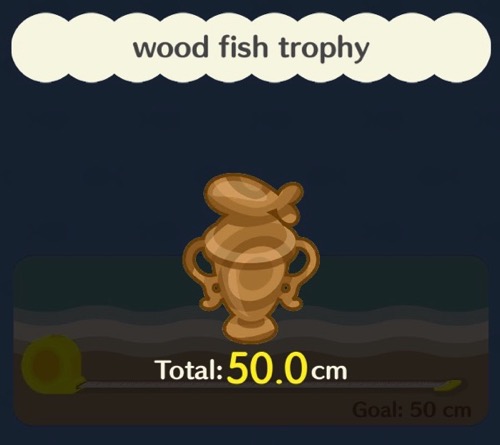 A wooden trophy with a fish on the top of it.