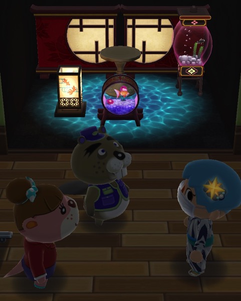 My Pocket Camp character is in the dark, with Chip and Lottie. There are three items from the Fishing Tourney behind them. Those items glow.