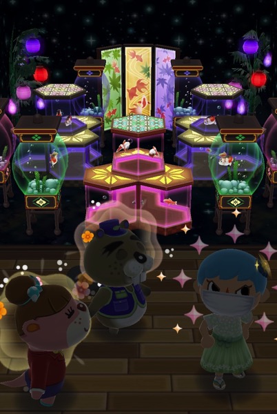 My Pocket Camp character standing with Chip and Lottie in front of a room full of glowing aquariums.