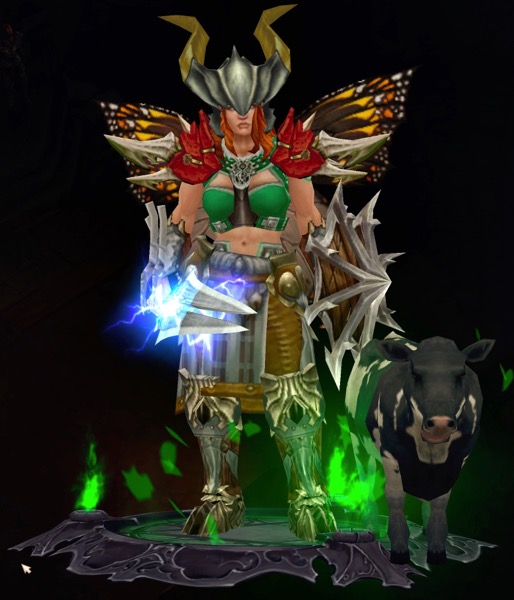 A female Barbarian wears a horned helmet, butterfly wings, and a mix of armor. Her shield has spikes on it. He sword shoots lightning. Next to her is a small calf.