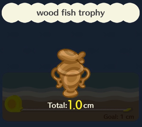 A fishing trophy made out of wood. It has a stylized fish on top of it.