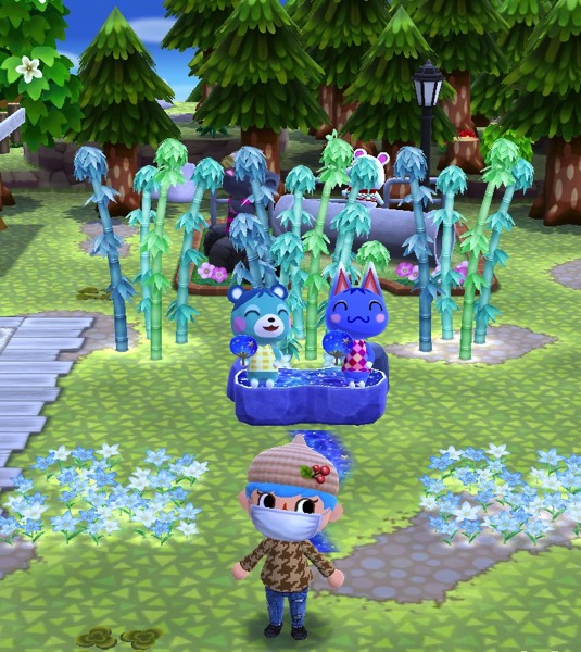 Bluebear and Rosie use the starry bench. Their eyes are closed and they hold up blue fans that have stars on them.