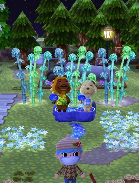 Bud and Goldie sit on the starry bench. Their eyes are closed. Each holds up a blue fan that has stars on it.