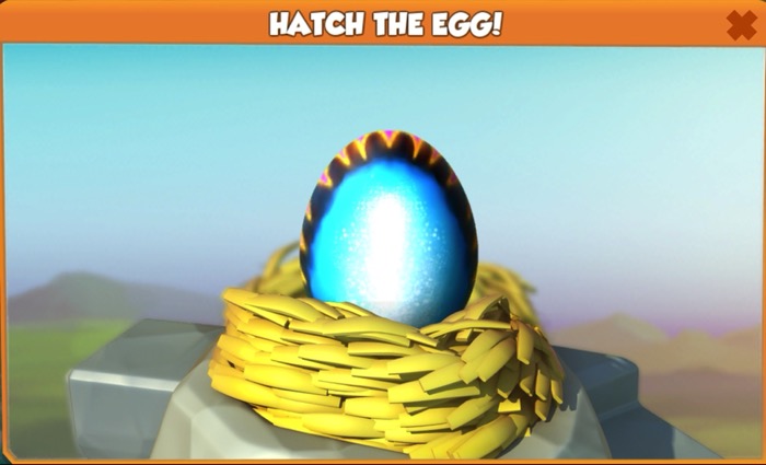 A egg with a bright blue glow sits in a nest. The egg has a black ring around the sides of it, that includes orange stripes.