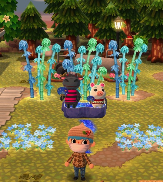 Rodeo and Flurry are sitting on the starry bench. Their eyes are open. Each of them hold blue fans that have stars on them.
