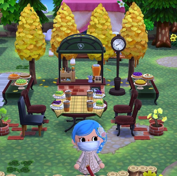 My Pocket Camp character stands in front of (nearly) all of the items from Celeste's Ginkgo Café. There is one black chair that is not part of the collection - but fits well enough.
