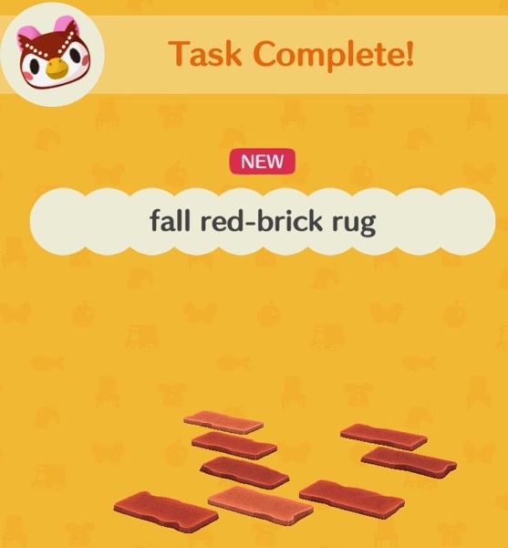 The fall red-brick rug looks like a scattered arrangement of bricks. All are red, and some are different shades of red.