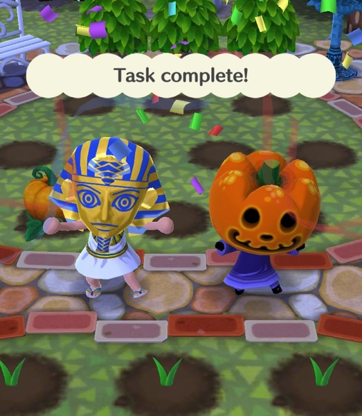 My Pocket Camp character is wearing a King Tut Halloween costume. They are standing next to Jack. Above them are the words "Task complete!"
