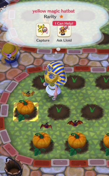 My Pocket Camp character is wearing a King Tut Halloween costume. She stands in a garden with orange pumpkins and a few hatbats.