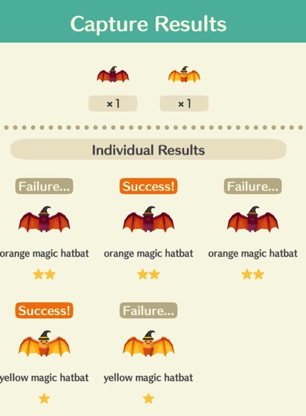 A box shows three purple and dark orange hatbats and two light orange hatbats. All are wearing witches hats. At the top of the box, it shows that I caught one of each kind.
