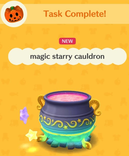 A colorful magic starry cauldron has golden feet and handles. Two small glowing stars are floating near it.