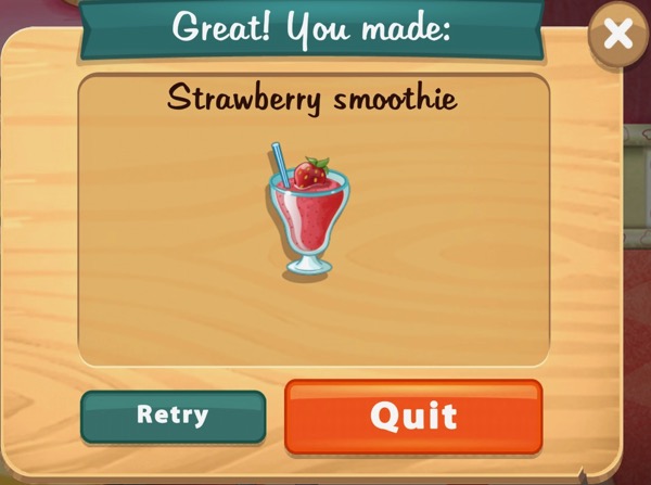 A red colored Strawberry smoothie is in a tall glass. A strawberry sits on top of it. A blue, straight, straw sticks out of the top of the glass.