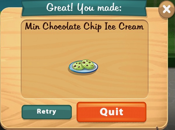 The Min Chocolate Chip Ice Cream looks like two green colored cookies with chocolate chips on them. The "ice cream" sits on a light blue plate with a dark blue ring around it.
