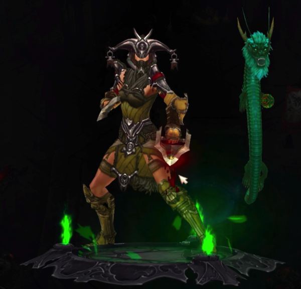 A Monk is wearing a helmet with horns that curve downward. Each horn has a decoration attached to the end of it. Her armor is green and plant-like, with some red highlights. Next to her is an emerald colored dragon that is floating in the air. The dragon is playing with a round green ball.