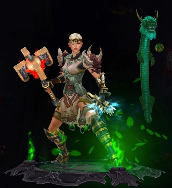 A Monk wears armor that is mostly white and grey. She has a small helmet circling her head. The shoulders she wears look like heads of demons. She carries a blade in one hand and a large hammer in the other. Next to her is an emerald colored dragon that is floating in the air. It is playing with a ball.