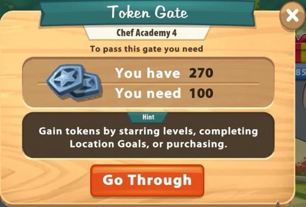 A sign show two blue tokens that have stars on them. The Token Gate requires 100 Tokens. I had 270 Tokens.