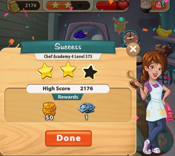 Pepper holds up one spoon and is happy. She holds a pink dishcloth in her other hand. The box next to her shows two gold stars. The top of the screenshot shows that I served eight servings of Cookie Dough Ice Cream.