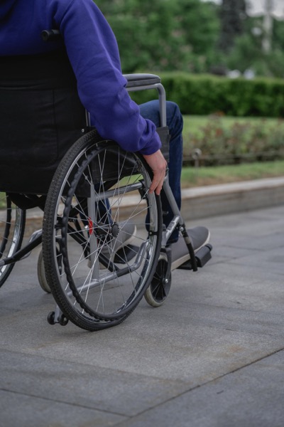 Person using wheelchair outside by SHVETS production on Pexels