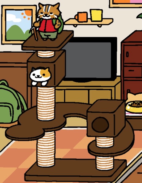 Bob the Cat stands on top of the highest perch on the Cat Metropolis. Sunny, a calico cat with light orange, white, and black coloring, is looking out from the box directly below the top perch.