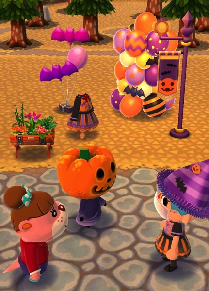 My Pocket Camp character is wearing the purple fright-night hat and the trick-or-treat dress. She stands outside, looking at Jack and Lottie. Behind them are a variety of items that are part of the Fright-Night event.