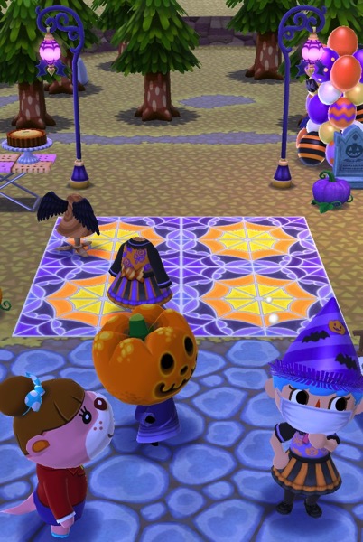 My Pocket Camp is thinking hard about where to put the required items. Jack and Lottie are watching her. Behind them is an unfinished scene where my character must place more items into.