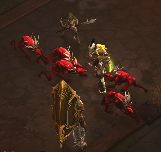 A Witch Doctor is wearing bright yellow armor. Five dog-like creatures stand near him. That Which Must Not Be Named stands off to the side, carrying a large pike weapon. The Templar appears to be trying not to get too near the dog-like creatures.