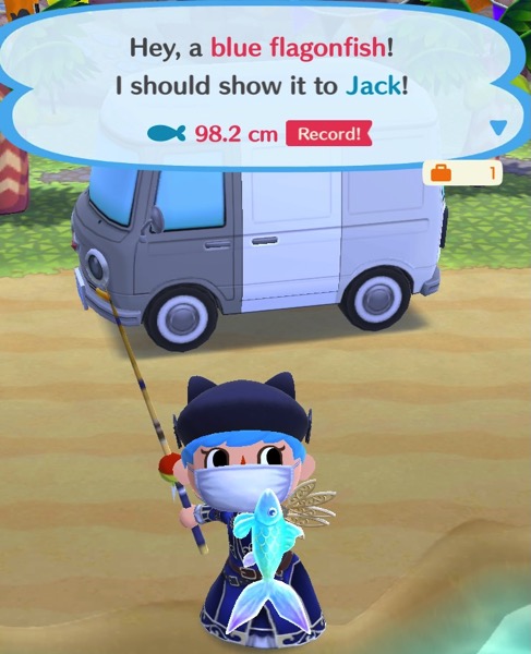 My Pocket Camp character holds up a blue flagonfish. The colors on it shimmer, as do all the fish in this Fishing Tourney.