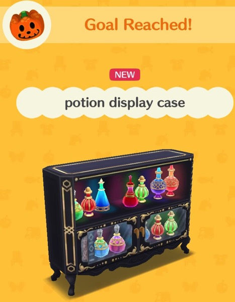 A black potion display case has an empty top shelf, a shelf full of tall, colorful, portions, and two glass doors below it that hold colorful, round, potions.
