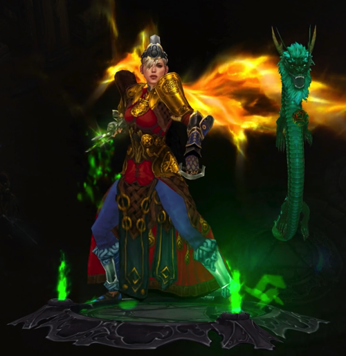 A Diablo III Monk is wearing armor that is mostly gold and red. She has wings of yellow-orange light. Next to her is a jade green dragon pet that floats in the air.