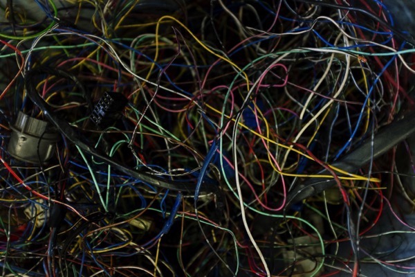 A mix of colored wires that are all tangled together by cottonbro on Pexels