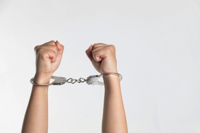 woman with handcuffs on by niu niu on Unsplash